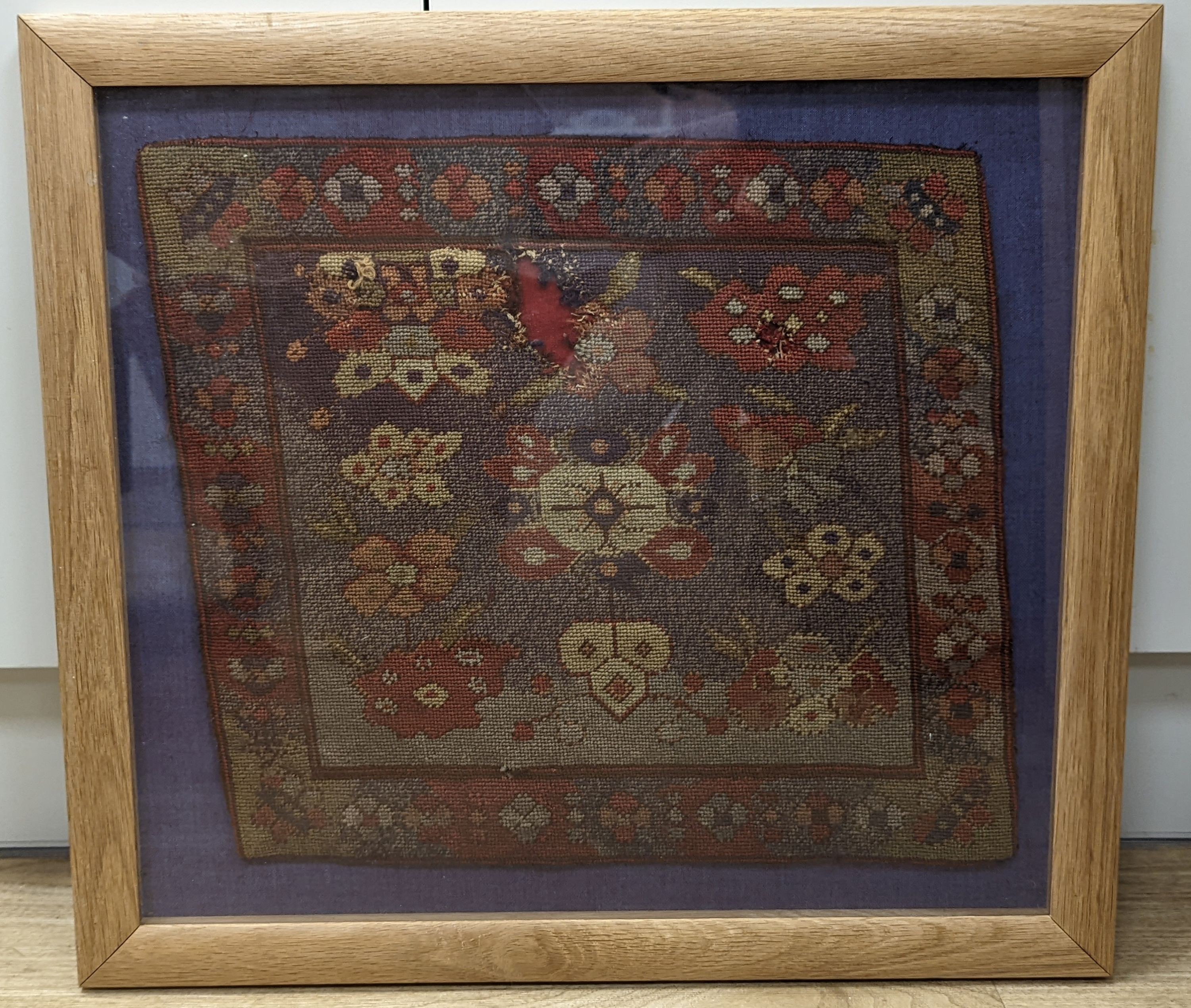 A 19th century Turkish petit point cushion cover, framed 38x43cm excl frame